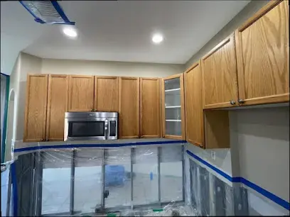 Kitchen with lower cabinets sealed in plastic containment during a Temecula dry-out